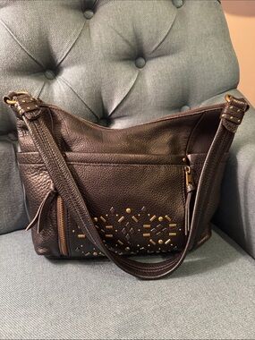 The Sak Black Leather Studded Shoulder Bag with Gold Accents